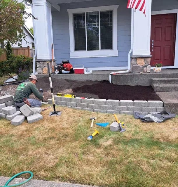 Stone retaining wall installation — Camberos Landscaping